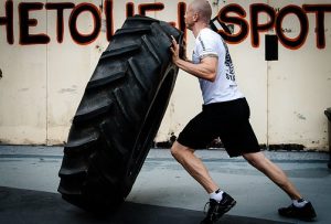 man tire flipping