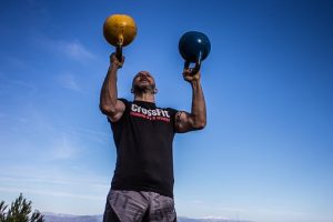 person holding kettlebells